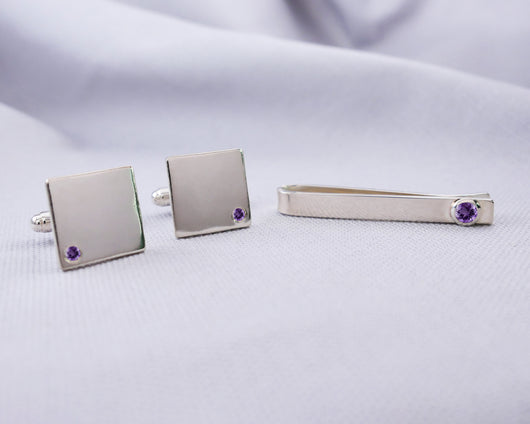 Silver tie bar and cufflink set with logo